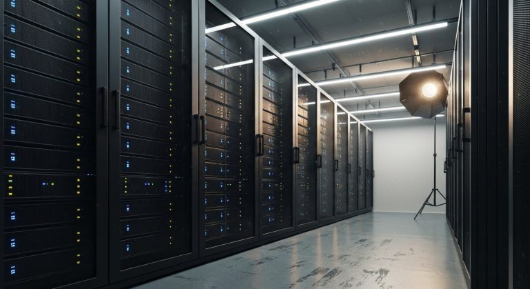 A professional wide-angle photo of a modern server room with matte black racks and soft blue status lights.